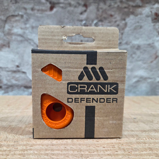 AMS Crank Defender in de verpakking