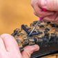 Muc-Off Puncture Plug Repair Kit in gebruik op MTB tubeless band